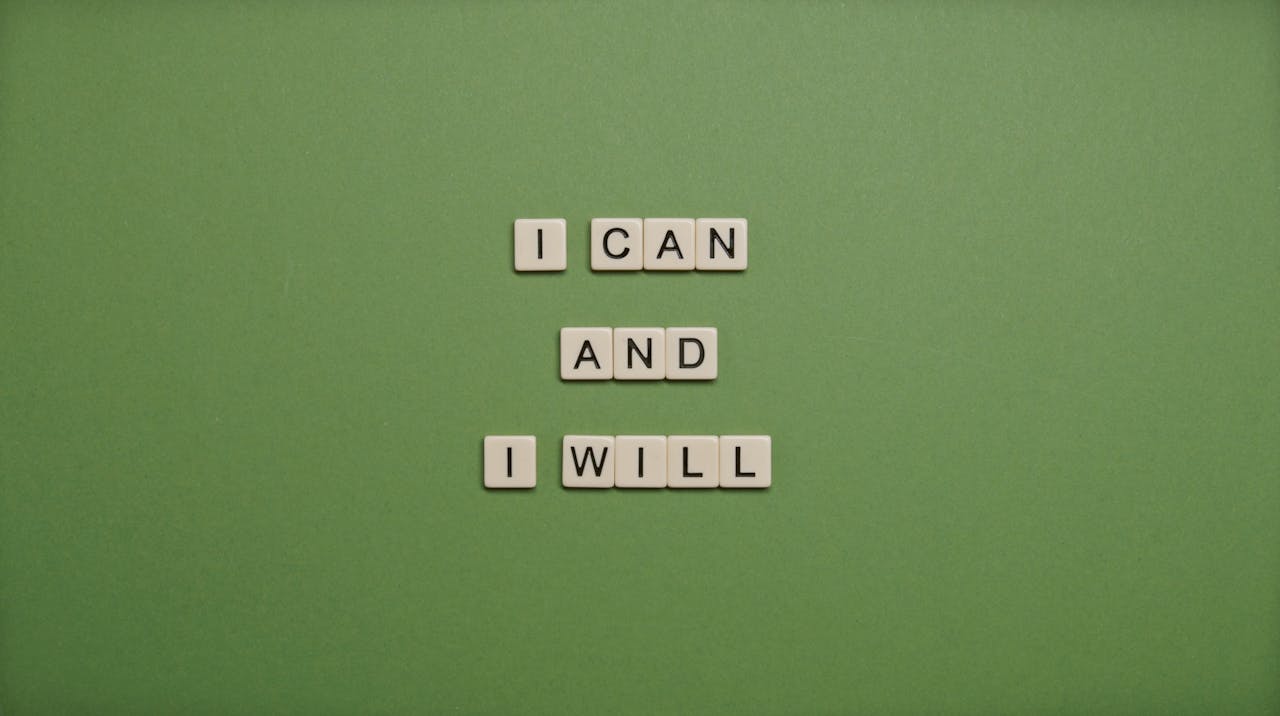 Scrabble letters spelling ‘I can, I will’ — a motivational reminder for single women building their own success.